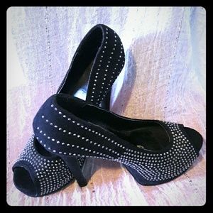 Black high heels covered in rhinestones